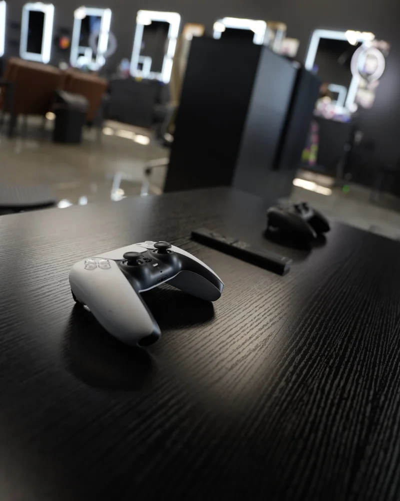 Game controllers on the lounge table at The Hause of Fades, Fort Myers