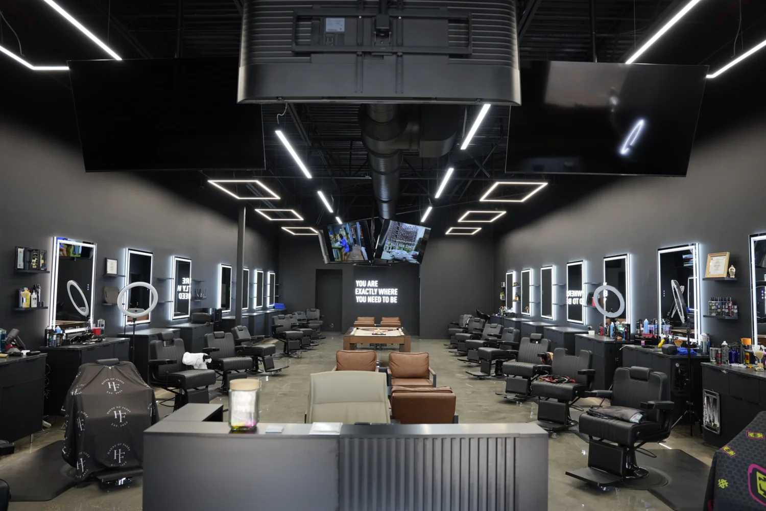Inside The Hause of Fades barber shop in Fort Myers, the chairs and stations